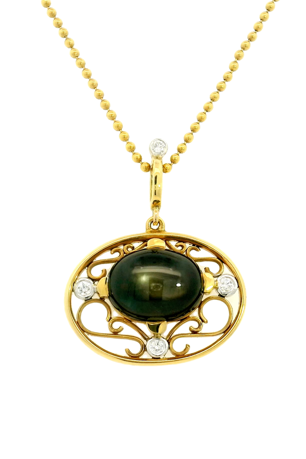 18ct yellow and white gold star sapphire pendant